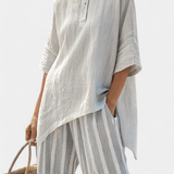 Fiorella – Elegant Asymmetric Blouse and Striped Trousers