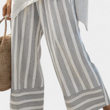 Fiorella – Elegant Asymmetric Blouse and Striped Trousers
